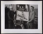 Sailors with bomb flag